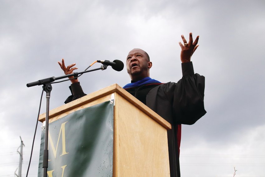 Thomas Tucker, Douglas County School District's superintendent, addresses the Mountain Vista High School graduating class on June 26 against the backdrop of a stormy sky. The ceremony was delayed one time for lightning.