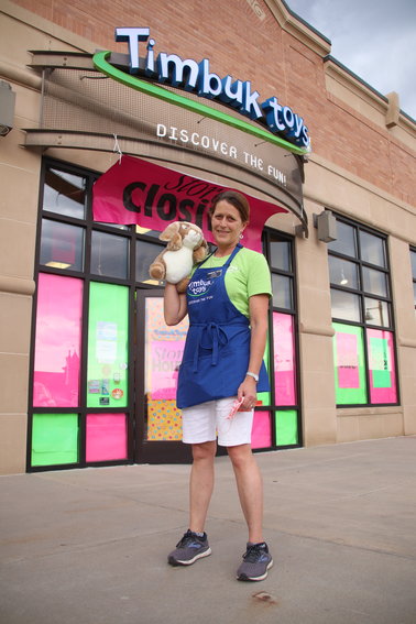 Timbuk Toys founder Sallie Kashiwa poses for a portrait in front of the store's Highlands Ranch location, which is in the process of closing.