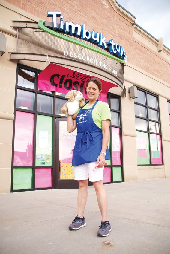 Timbuk Toys founder Sallie Kashiwa poses for a portrait in front of the store’s Highlands Ranch location, which is in the process of closing.