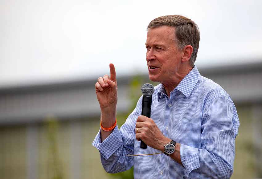 Then-presidential candidate John Hickenlooper greets supporters at the Iowa State Fair in Des Moines, Iowa, on Aug. 10, 2019.