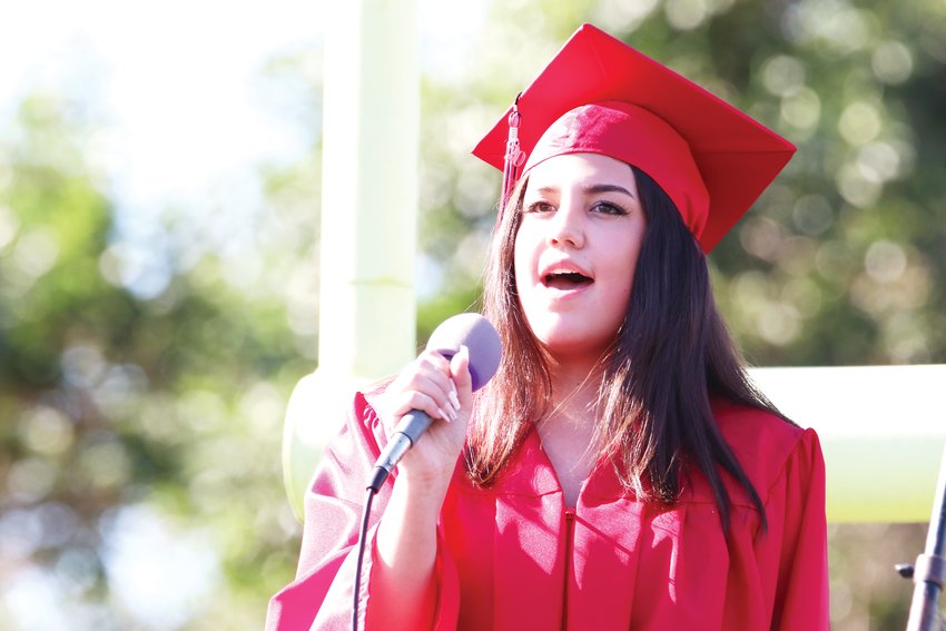 Student Mia Molina performs Mariah Carey’s “Hero” during Eaglecrest’s graduation ceremony.