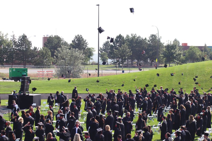 After the socially distanced ceremony, graduates celebrated by throwing their caps in the air.