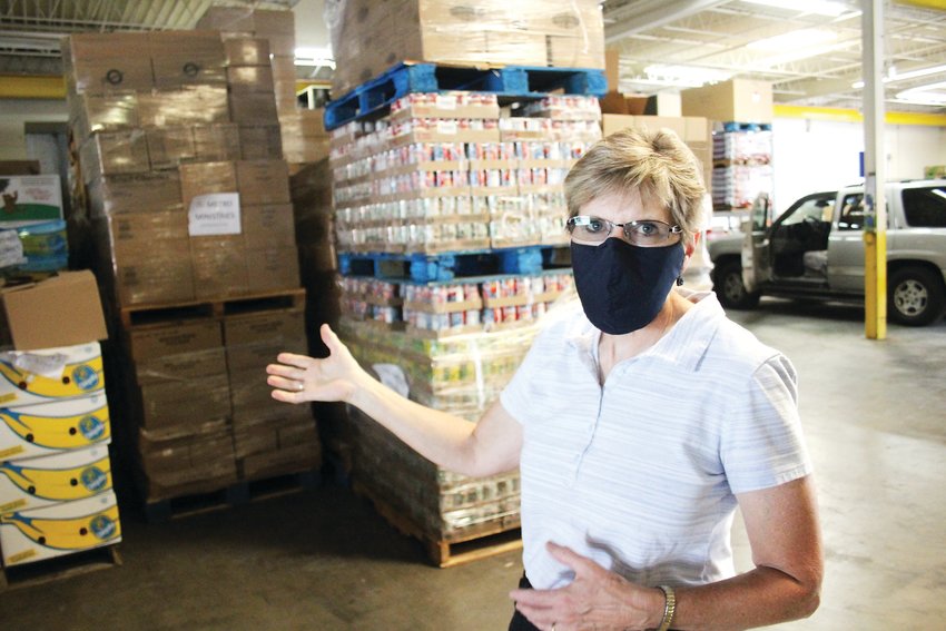 Joyce Neufeld, president of the Food Exchange Resource Network, shows off the network’s Englewood warehouse. Last year, 202,000 area residents were served through the food pantries of the network.
