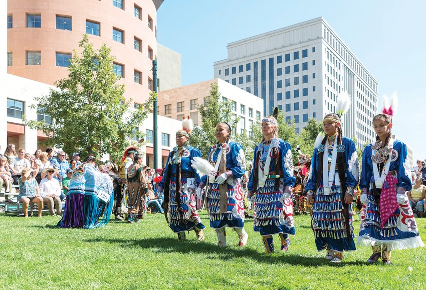 A group of dancers form a line during a dance at last year’s Denver Art Museum Friendship Powwow.