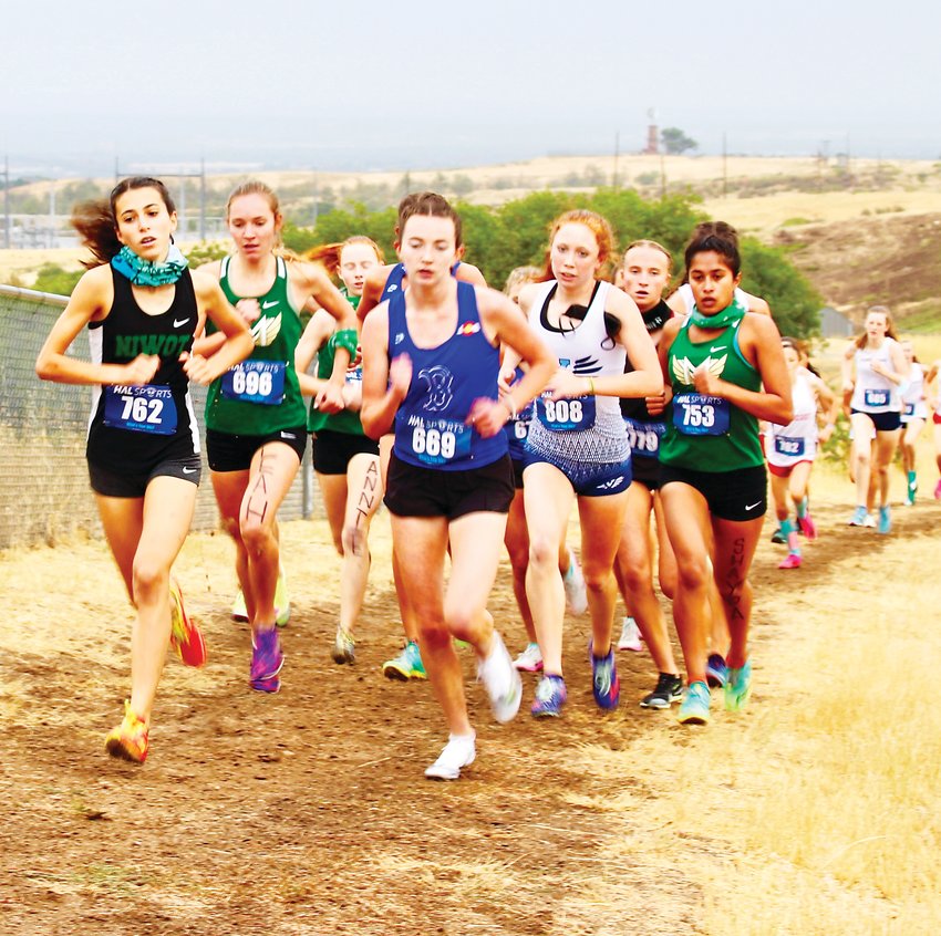 Valor Christian's Taylor Whitfield, shown on the right, won the girls race on Aug. 28 at the Vista Nation XC Two-Mile Invitational meet with a time of 11:27.