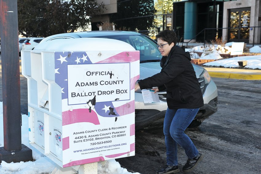 April Patrick of Westminster drops off her ballot at the Adams County Office complex at 12200 N. Pecos Street for the 2019 ballot.