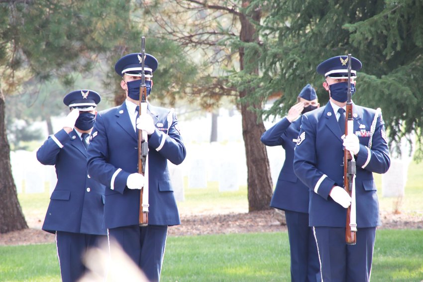 Military personnel at Fort Logan National Cemetery salute during the Sept. 18 memorial service for Tom Munds. Munds, who died Feb. 6 at 82 after a battle with cancer, spent 21 years in the Air Force and went on to cover Englewood as a news reporter for decades. Current and former Englewood city officials attended his service.