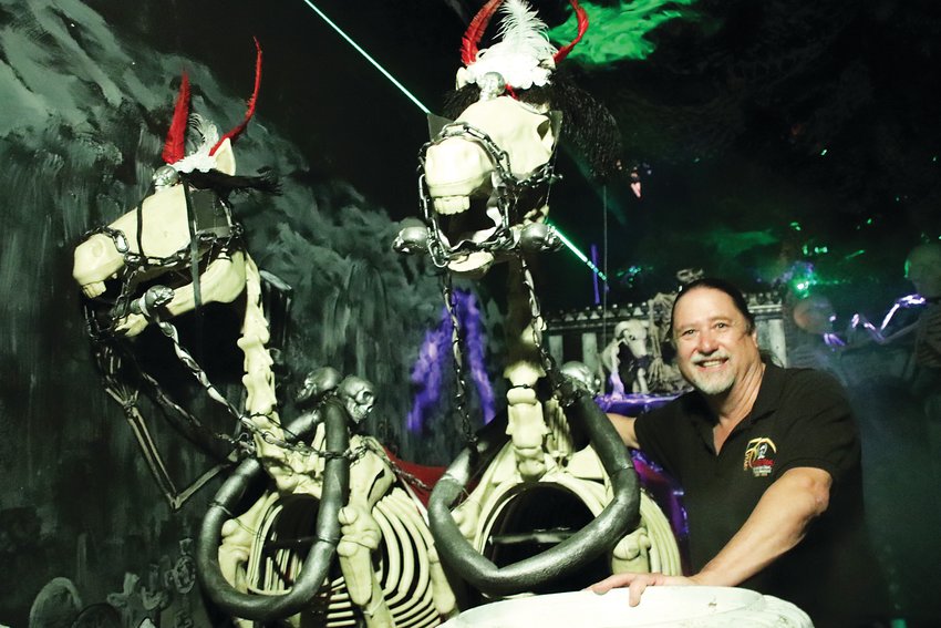 Greg Reinke, owner of the Reinke Bros. costume and magic emporium, hangs out with a couple of undead horses pulling a spooky carriage in the Haunted Mansion, one of just a few haunted houses operating in the Denver area this year.