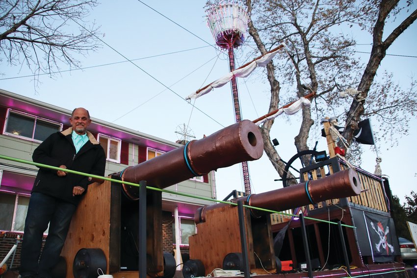 Sean Meighan stands on the pirate ship he built in his front yard. The project took four months.