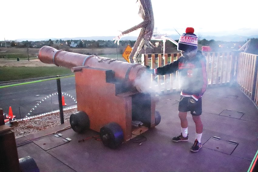 Ryder Siegel, 6, tries out a cannon on Meighan's pirate ship. The cannons release fog, play a loud sound and flash a red fog light when pressed.