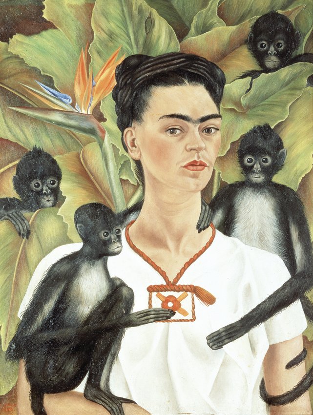 Frida Kahlo’s 1943 painting “Self-Portrait with Monkeys” is on display at the Denver Art Museum through Jan. 24.