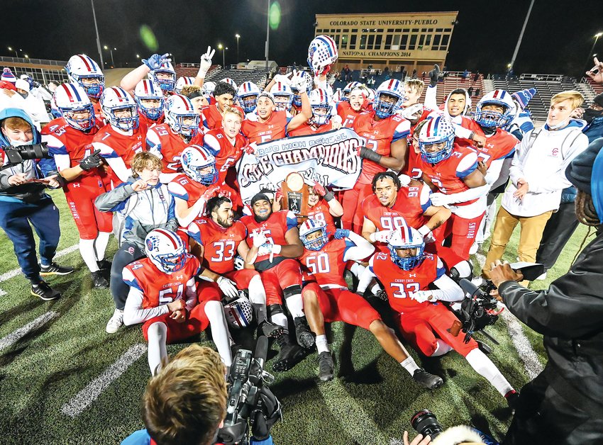 The Cherry Creek Bruins celebrate their repeat performance as 5A state champions by defeating Valor Christian 21-0 in the 5A state final Dec. 5 at the CSU Pueblo Thunderbowl.