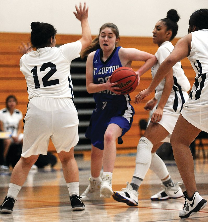 Fort Lupton’s Breanna Carroll drives the lane against Pinnacle’s Nailea Barron during a January game in Fort Lupton.