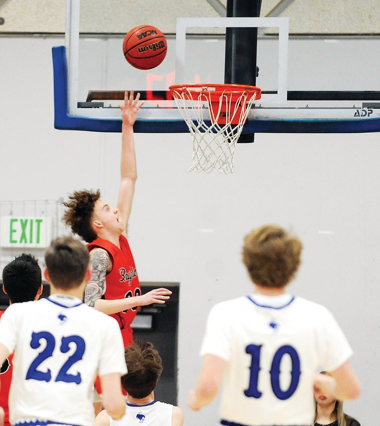 Brighton’s Blake Ferguson goes for the layup against Broomfield during the Class 5A first round of playoff action Feb. 26 at Broomfield High School.