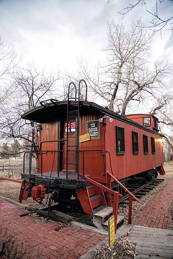 The Caboose Gallery at the Depot Art Gallery in downtown Littleton. Photographer Samuel Howard displays his art inside it.