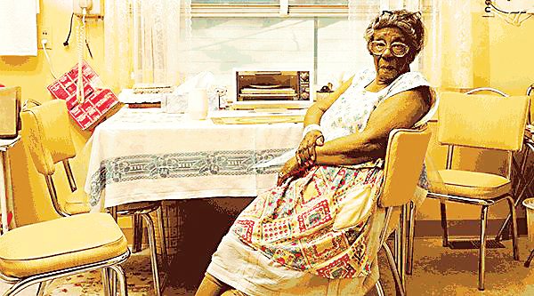 Ada Florence Ashford, 95, is shown in her kitchen wearing the apron she put on first thing each morning in this 2004 photo by Kristina Loggia, part of the “Apron Chronicles” exhibit opening Jan. 23 at History Colorado.