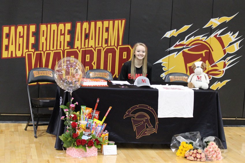 Eagle Ridge Academy's Macey Lauridson signs her NLI in the school's gymnasium