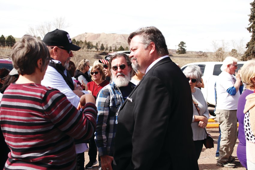 Douglas County Commissioner George Teal, right, speaks to attendees of a March 9 rally in Castle Rock.