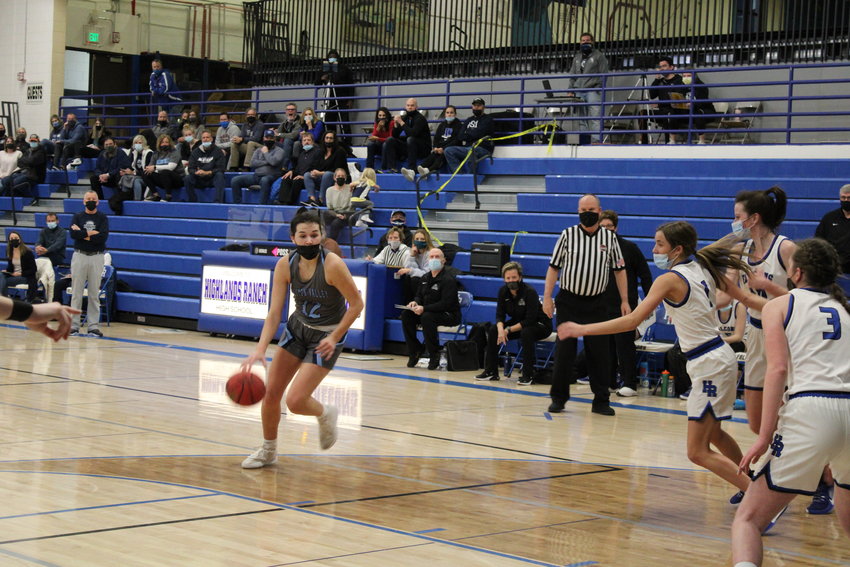 Ralston Valley's McKenna Nichols gets set for a shot attempt as a cadre of Highlands Ranch defenders attempt to close out.