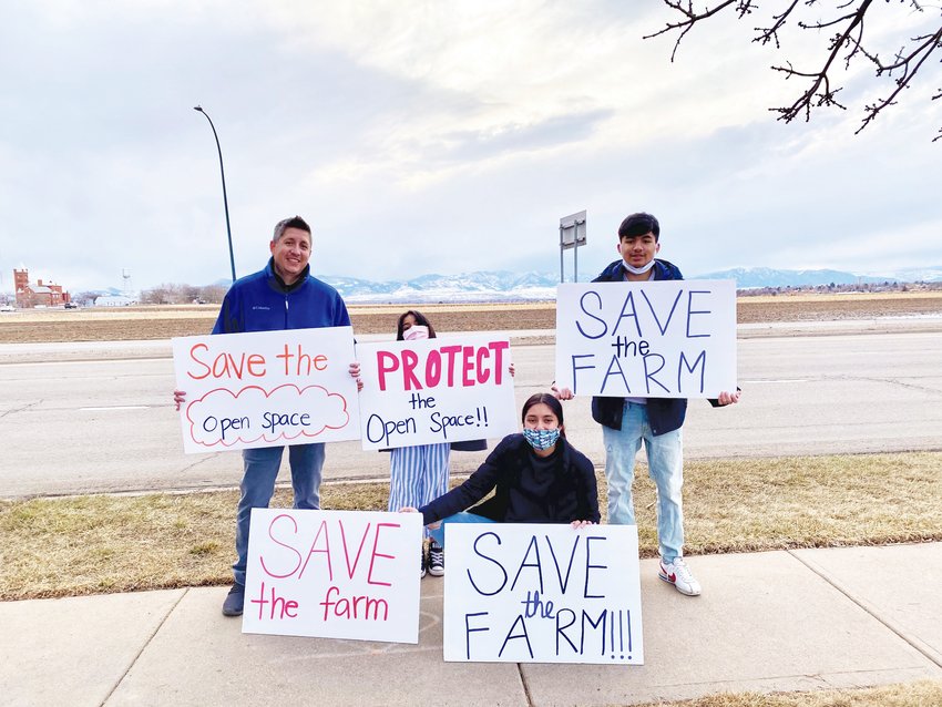 Supporters of Save the Farm, a community group that opposes the proposed 233-acre Uplands development in Westminster, came out for a March 25 protest. Among issues that people expressed concern over was how much parks and open space the developer is proposing to include. The Merida family — Karl, Paloma, Rosie and Henrique—were among those at the event.