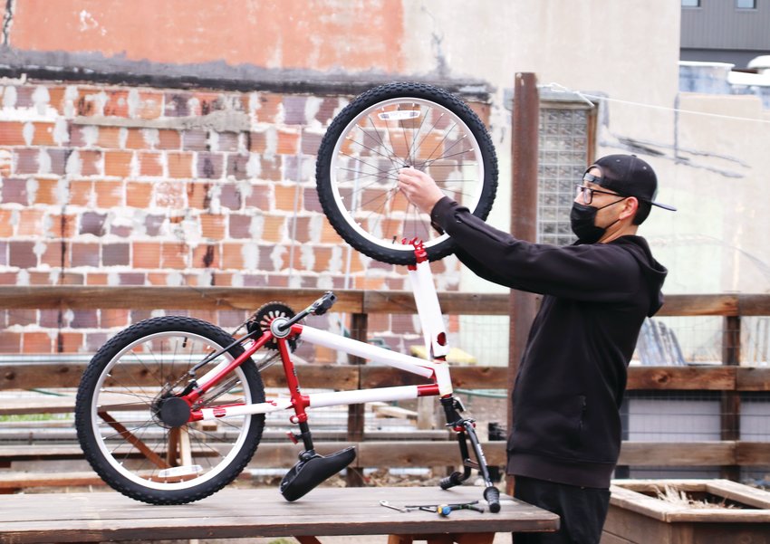 Dre Lopez of Littleton grew up BMX-ing and believes bikes are a great way for youth to enjoy the outdoors. The April 22 event was the second time Lopez has volunteered to build bikes for Can‚Äôd Aid.