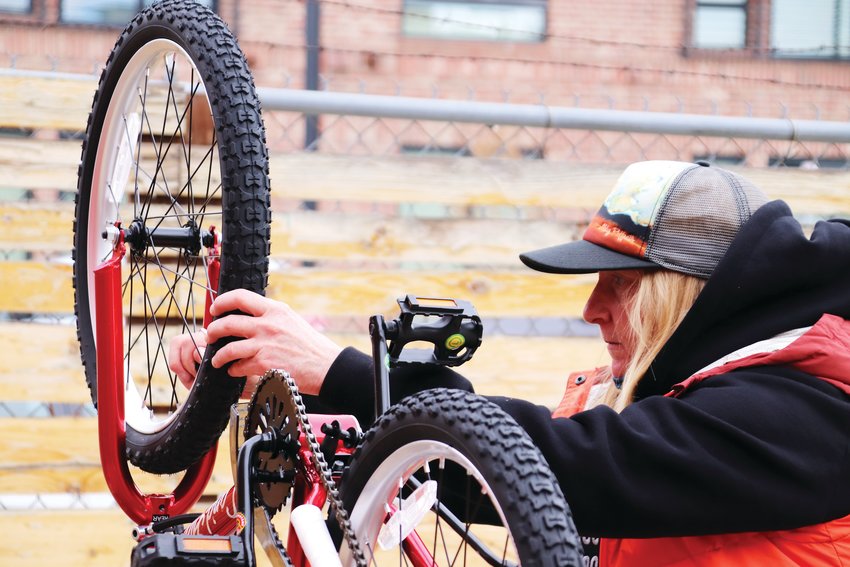 Amanda Willshire of northwest Denver discovered her love of welding through volunteer work, she said. Willshire has volunteered with Can’d Aid before, but the April 22 event was the first time she had built bikes with the organization.