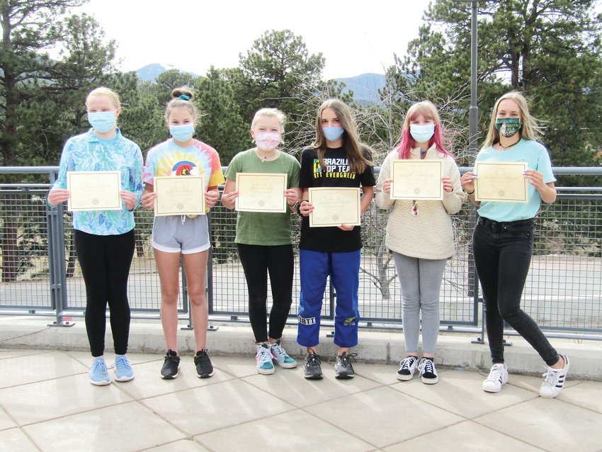 From left, Claire Naumer, Kaia Ruleman, Lillie Beach, Alyssa Diflumeri, Skylar Carpenter and Molly Hochmuth stand with their certificates after an awards ceremony for a writing contest sponsored by Resilience1220, HearthFire Books and Evergreen Country Day School.