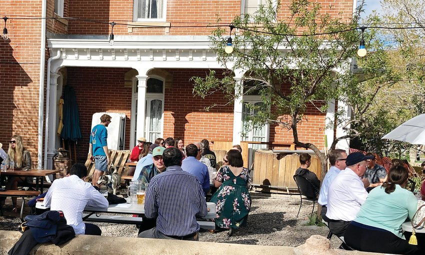 A crowd drinks outside Golden City Brewery on May 13.