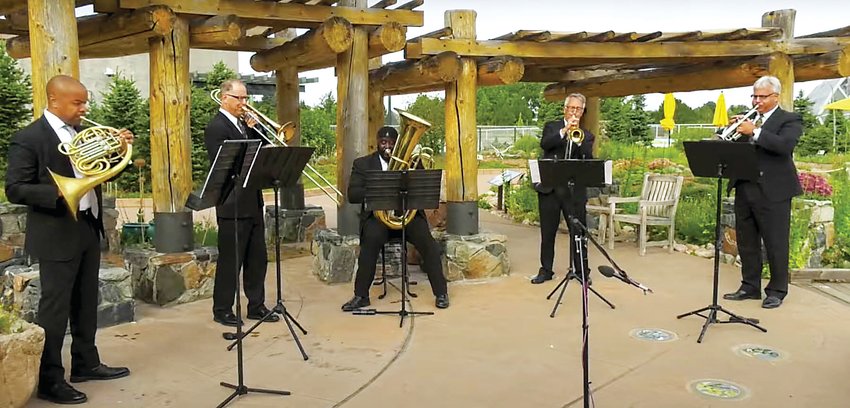 The Denver Municipal Band performs at the Denver Botanic Gardens in a past year. The band will again be making its way around the city this summer to perform its free concerts in the park.