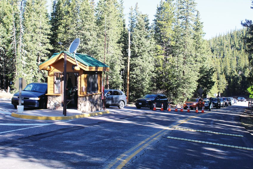 Motorists line up at the entrance of the Mount Evans Scenic Byway near Echo Lake Friday morning. When the gates opened at 8 a.m., there were about 40 vehicles already in line to enter.‚Äã