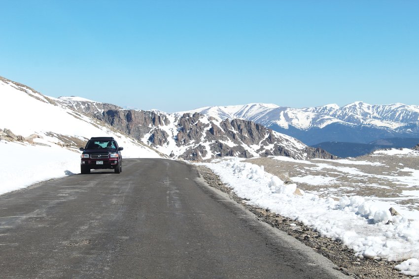 An SUV traverses the Mount Evans Scenic Byway Friday morning after the highway reopened to vehicle traffic for the first time since September 2019.