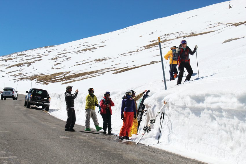 A group of skiers exit a snowfield along the Mount Evans Scenic Byway Friday morning. The group, which included an octogenarian, has been skiing at Mount Evans for several years.