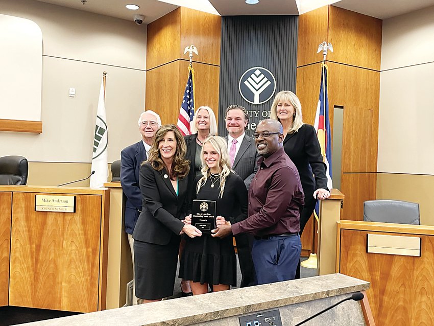 Dylan Daniels, 2021 Outstanding Youth of Lone Tree Award winner, celebrates with the Lone Tree City Council and a representative from Canvas Credit Union, one of the award’s sponsors.