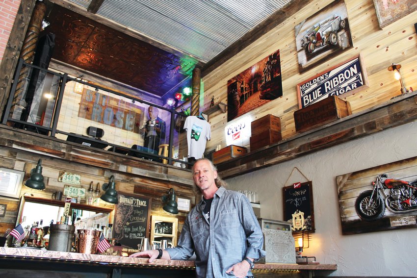 511 Rose co-owner Ron Grady stands along the restaurant's bar underneath the music stage June 17. Grady and his wife Terri opened the restaurant/retail business at 511 Rose St. in Georgetown on May 11.