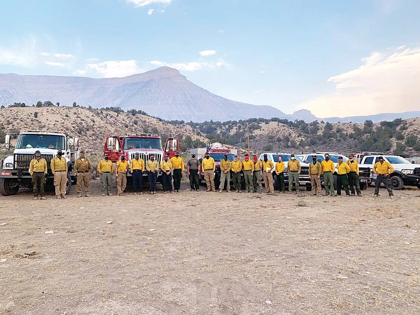 Crews of firefighters from around the country stand their equipment for a group photo in 2020 during their time fighting the Pine Gulch Fire, which was burning north of Grand Junction. Thornton Fire Lieutenant Perry Otero led the team for two weeks in August.