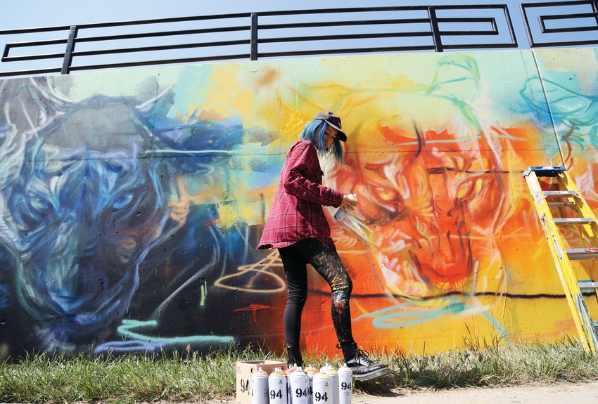 Muralist Emily Ding is one of almost 30 artists to paint during the Babe Walls Mural Festival which celebrates womxen and non-binary artists.
