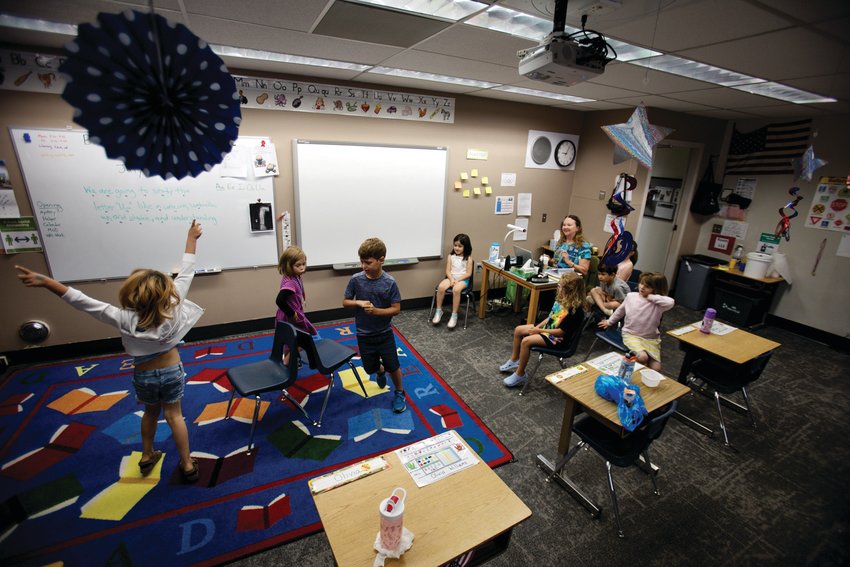 CeCe Walker’s summer school class plays musical chairs after breakfast to wake up their brains.