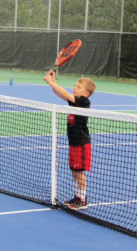 Connor Kemmis, 5, waits to return a tennis ball.
