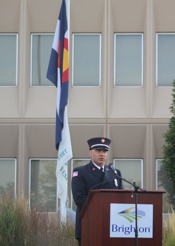 Brighton Fire Rescue District Lt. Gary Dawson emcees the 9/11 program at City Hall.