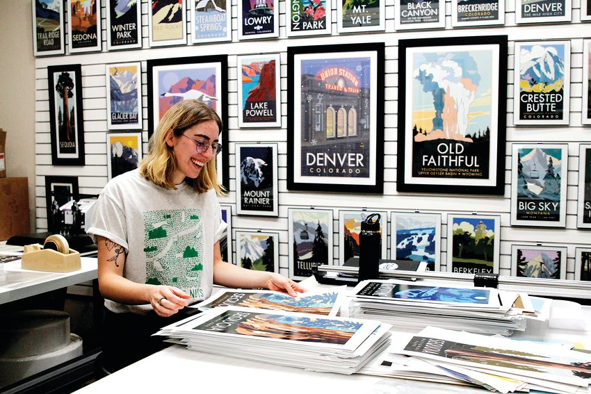 Designer Jenna Ball processes damaged posters in the studio of Travel Posters in Englewood Sept. 8.