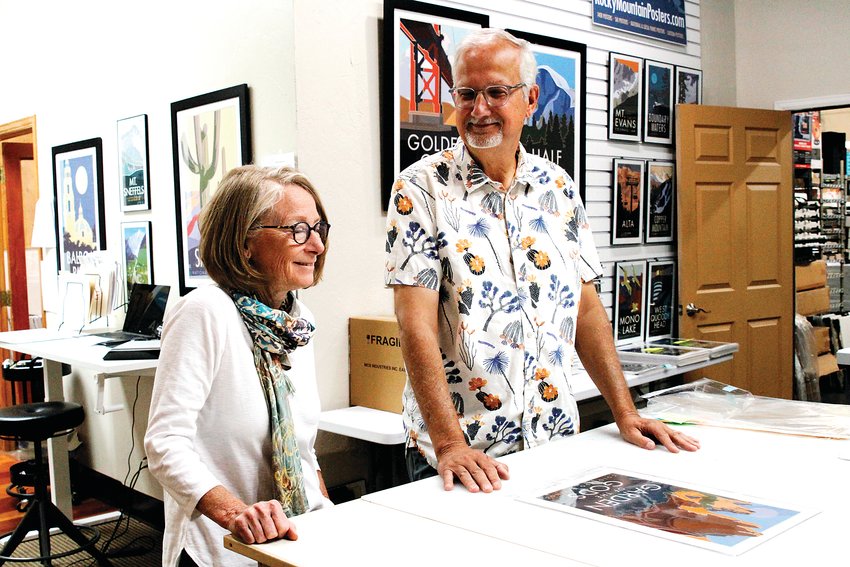 Owners Lauri and Blair Hamill in the Travel Posters studio in Englewood Sept. 8.