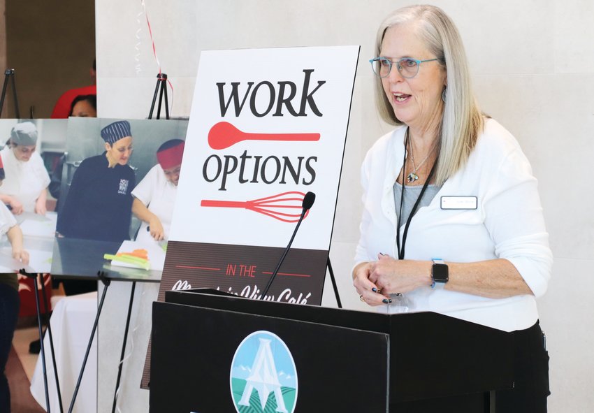 Work Options Executive Director Julie Stone talks about the group's latest effort, working with Adams County to bring job services and skill building for food service workers to Westminster at a press conference Sept. 15.