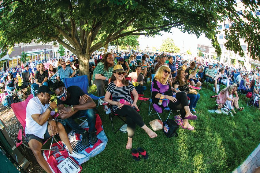 A crowd sits at The Streets at SouthGlenn outdoor mall in Centennial in June during a free concert. City officials have announced the formation of the nonprofit Centennial Arts and Cultural Foundation with a mission “to celebrate, inspire, and connect art and culture in Centennial.”