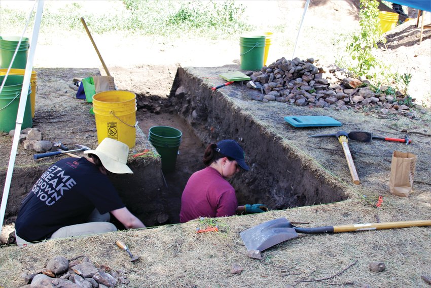 Archaeology students work on the dig site at the Astor House yard.