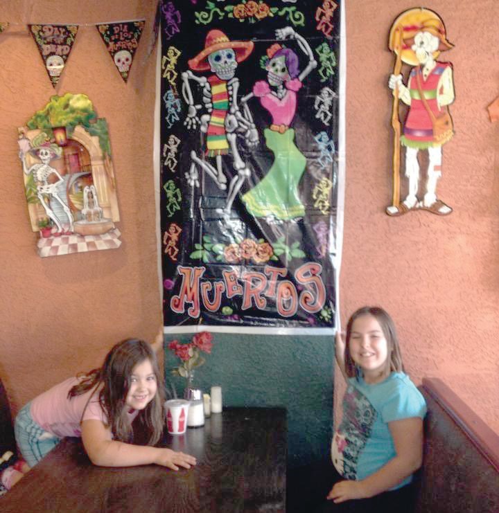 My two nieces, Cassie, left, and Morgan, let me take their picture inside a restaurant while out celebrating Día de los Muertos in Denver one year — circa 2013.