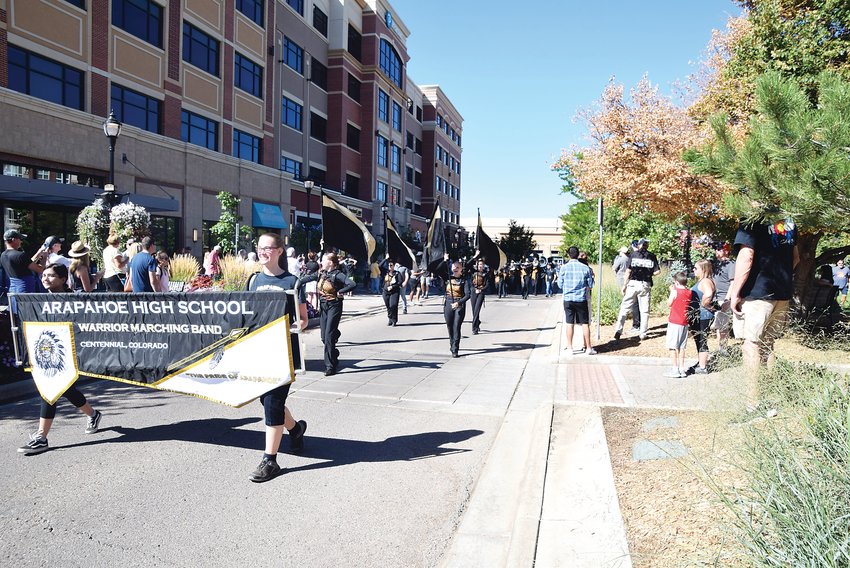 The Arapahoe High School homecoming parade rolls through The Streets at SouthGlenn outdoor mall in west Centennial during a Sept. 18 celebration highlighting that two decades have passed since Centennial's beginnings as a city.