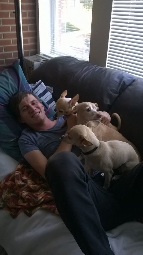 Hix with his parents' dogs.