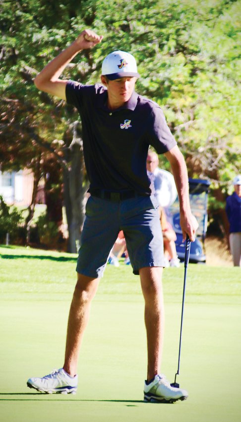 Arapahoe’s Will Kates won the state Class 5A individual golf title with a putt  on the second playoff hole and led the Warriors to their first team championship in 33 years. Here he reacts after sinking the birdie putt to win the playoff.
