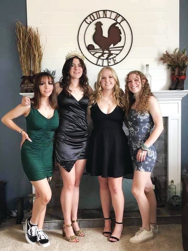 Maddie Johnson (send from the left) and some of her friends before the Homecoming dance on October 9th.