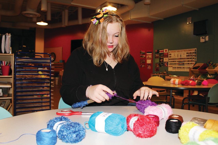 Wheat Ridge’s Ryli Litz wraps yard around an intention stick during the Oct. 15 Rec Center Takeover in Idaho Springs.